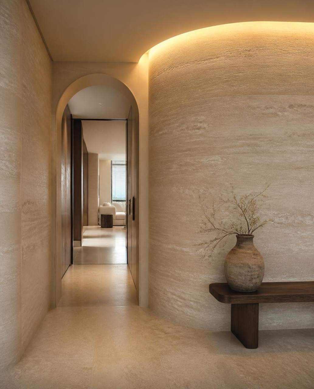 Curved archway finished in sandy soft textured stone